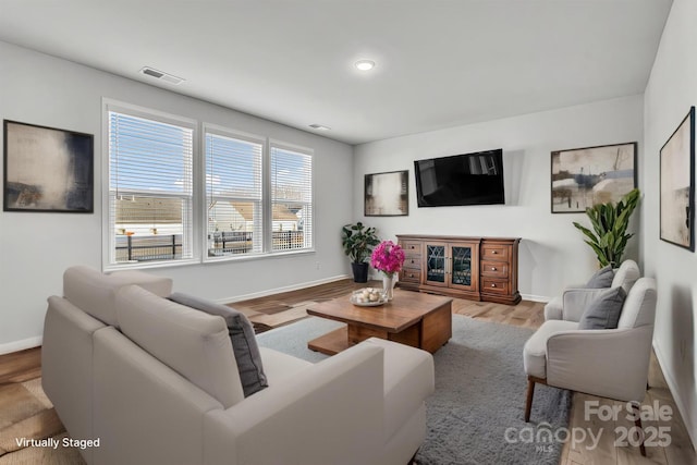 living room with light hardwood / wood-style floors