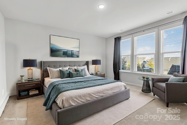 bedroom featuring light colored carpet