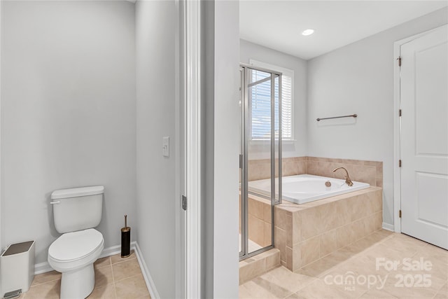 bathroom featuring separate shower and tub, tile patterned flooring, and toilet