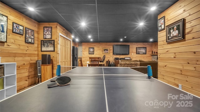 game room featuring wooden walls