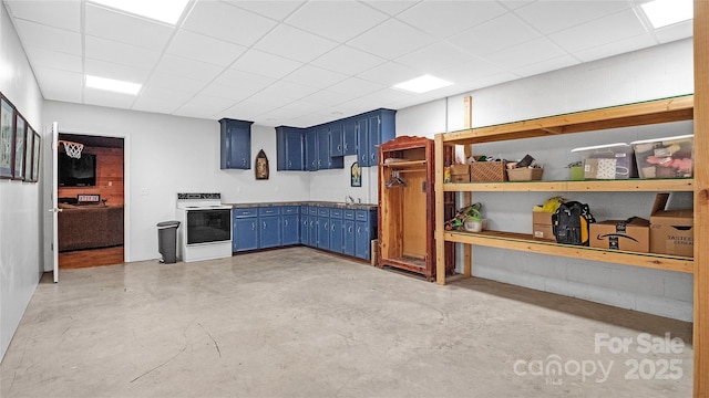 interior space with a drop ceiling, sink, white electric range, and blue cabinetry