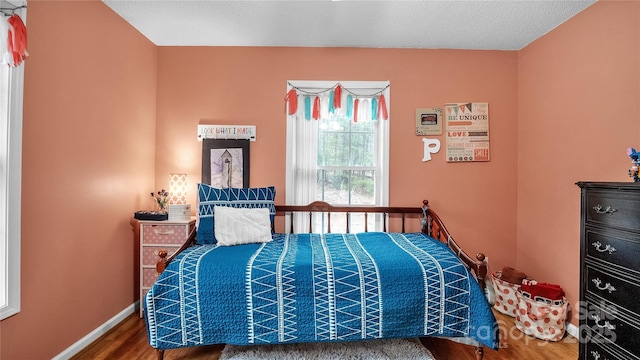 bedroom featuring hardwood / wood-style flooring