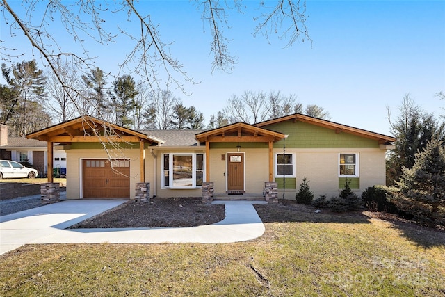 view of front of home featuring a garage and a front lawn