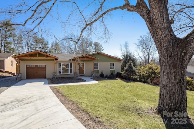 single story home with a front yard and a garage