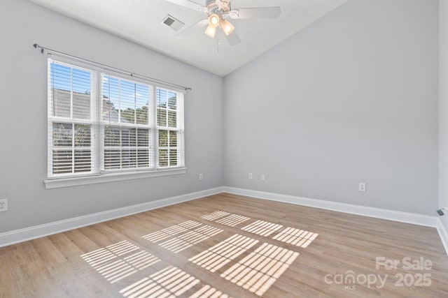 spare room featuring light hardwood / wood-style floors and ceiling fan