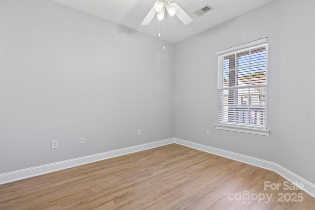 unfurnished room with ceiling fan and light wood-type flooring