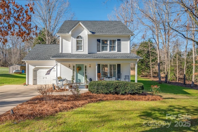 view of front facade with a porch, a garage, and a front yard