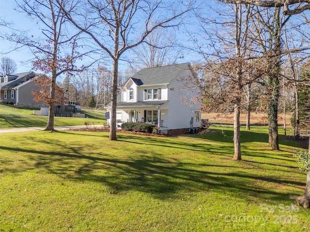 view of property exterior with a lawn and covered porch