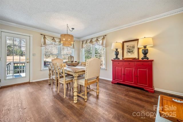 dining area featuring crown molding, dark hardwood / wood-style floors, and a textured ceiling