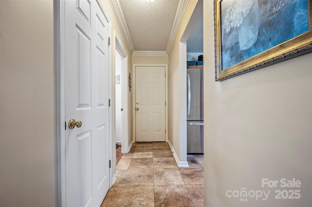 hallway with crown molding and a textured ceiling