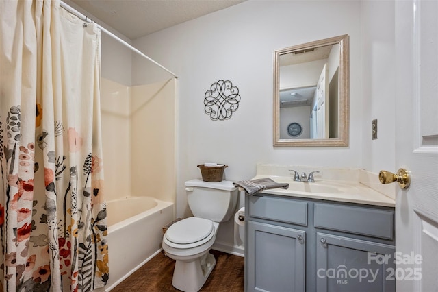 full bathroom with shower / bath combo with shower curtain, vanity, and toilet