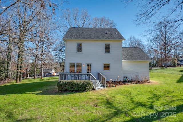 back of house with a lawn and a wooden deck