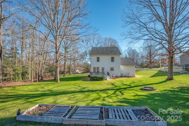 back of property featuring a yard