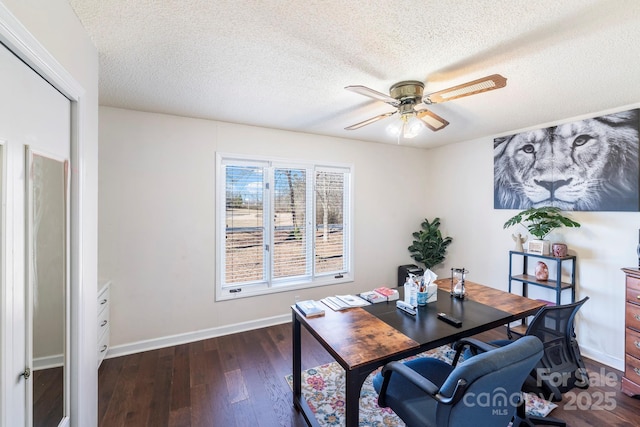 office space with a textured ceiling, ceiling fan, and dark hardwood / wood-style floors