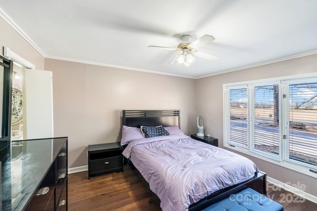 bedroom with ornamental molding, ceiling fan, and dark hardwood / wood-style floors