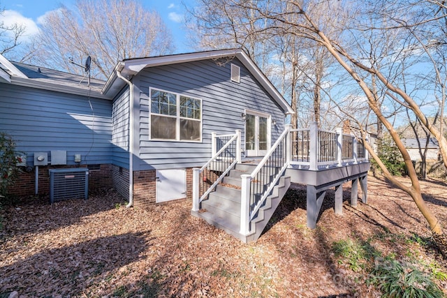 rear view of house with a wooden deck