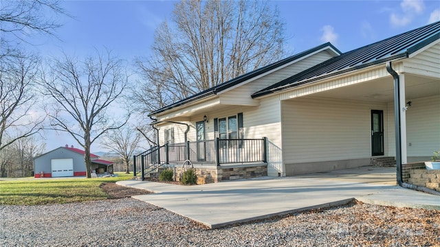 view of side of home with a carport