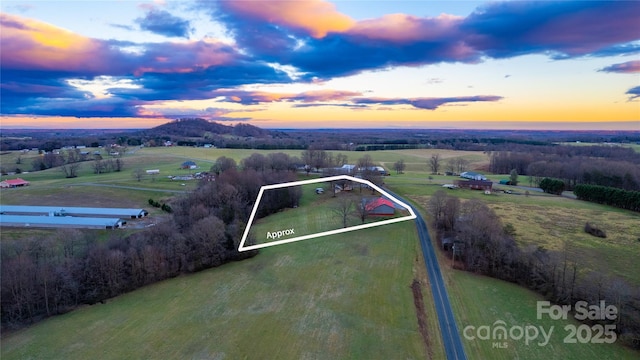 aerial view at dusk with a rural view