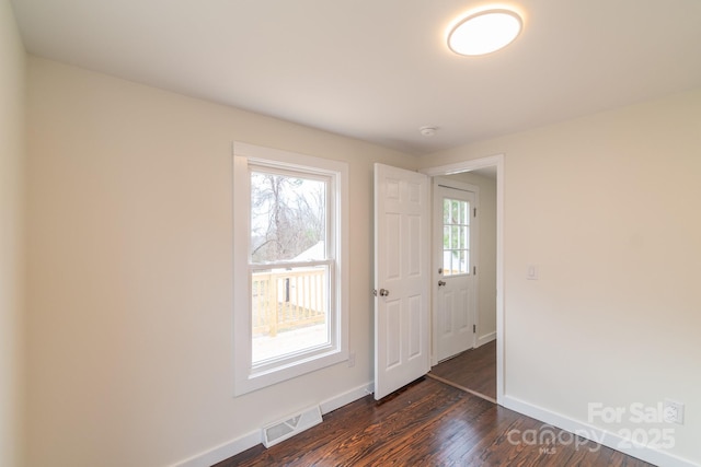 entrance foyer featuring dark wood-type flooring