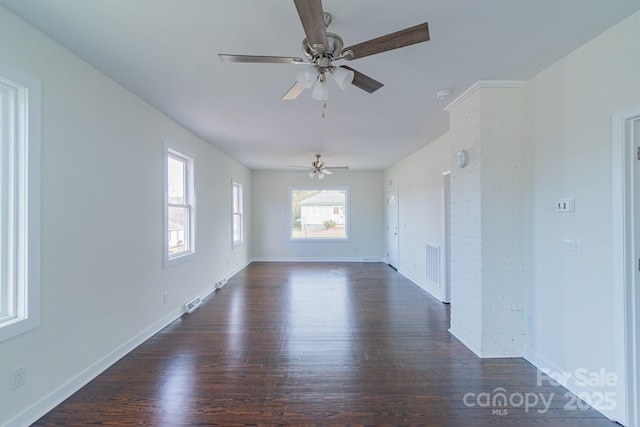 spare room with ceiling fan and dark wood-type flooring