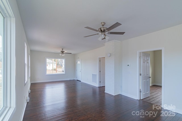 empty room featuring dark hardwood / wood-style flooring and ceiling fan