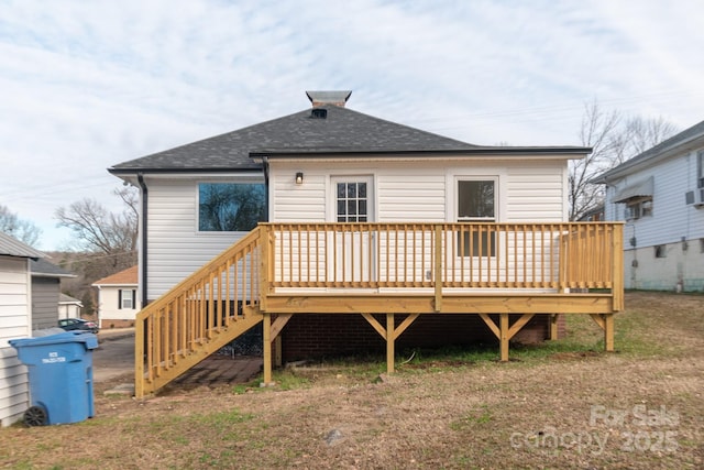 rear view of property with cooling unit and a deck