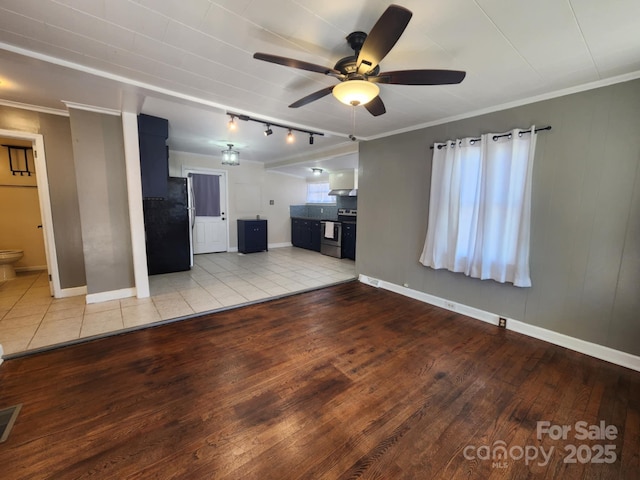 unfurnished living room with light hardwood / wood-style flooring, ceiling fan, and crown molding