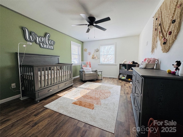 813 S Zion St, Landis, NC 28088 - bedroom with a nursery area, dark wood finished floors, and ceiling fan