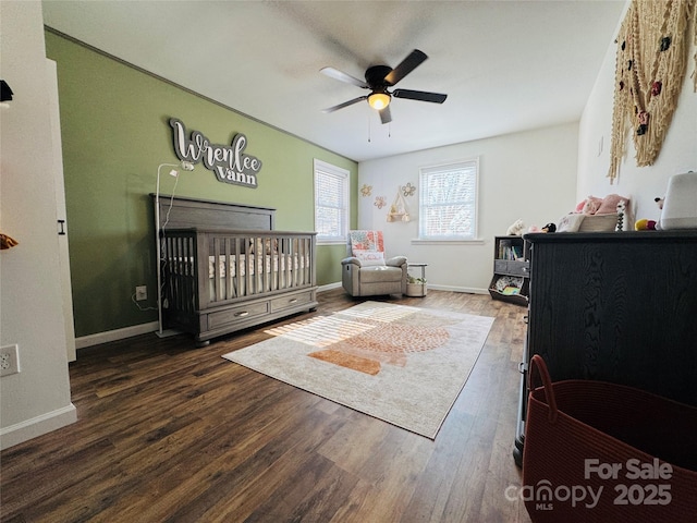 813 S Zion St, Landis, NC 28088 - bedroom featuring a crib, wood finished floors, and ceiling fan