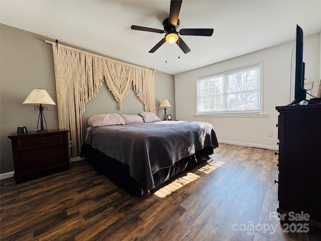 bedroom featuring ceiling fan and dark hardwood / wood-style flooring