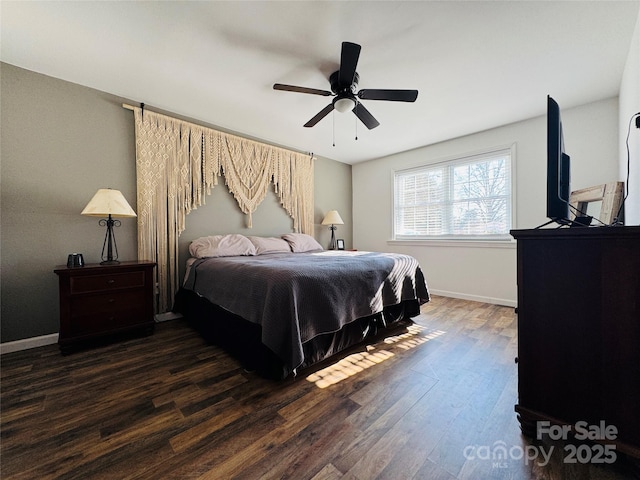 bedroom featuring ceiling fan and dark hardwood / wood-style floors