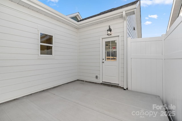 doorway to property with a patio