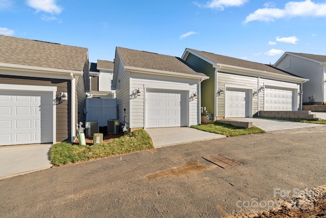 single story home with a garage and central AC