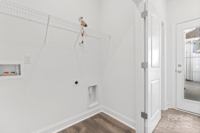 clothes washing area featuring laundry area, hookup for a washing machine, electric dryer hookup, baseboards, and dark wood-style floors