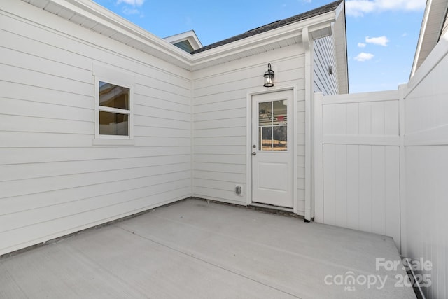 property entrance featuring a patio