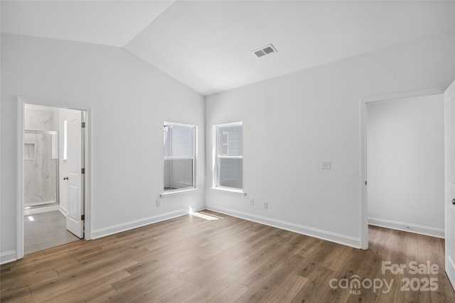 143 Cherry Springs Ln Unit 13-C, Asheville, NC 28804 - unfurnished room with lofted ceiling, wood finished floors, and healthy amount of natural light