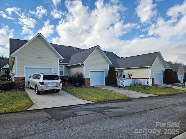 single story home with a front yard and a garage