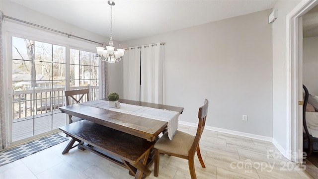 dining area featuring a notable chandelier