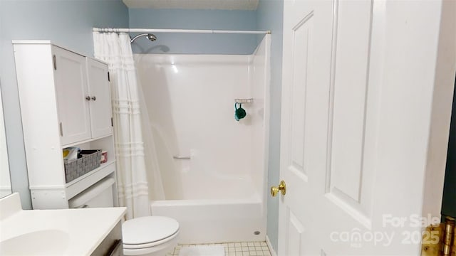 full bathroom with tile patterned floors, vanity, shower / tub combo, and toilet