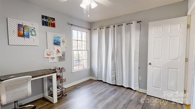 interior space with hardwood / wood-style flooring, a wealth of natural light, and ceiling fan