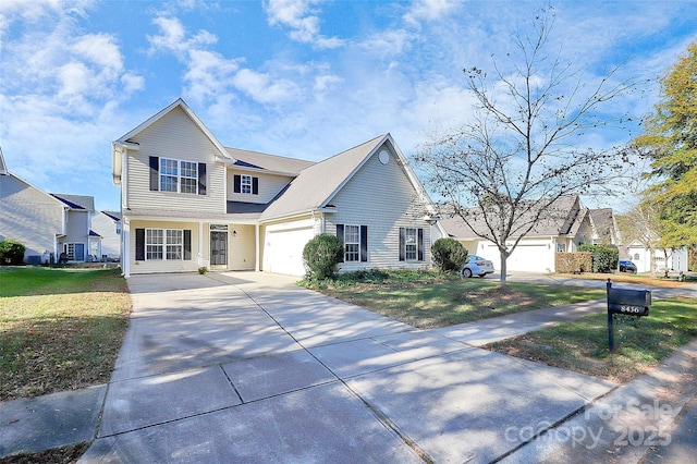 view of property with a garage and a front yard