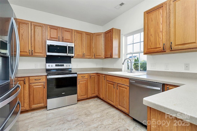 kitchen with sink and stainless steel appliances