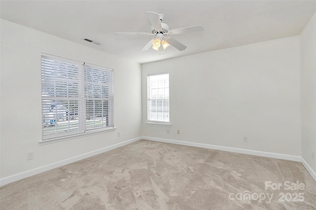 carpeted empty room with ceiling fan