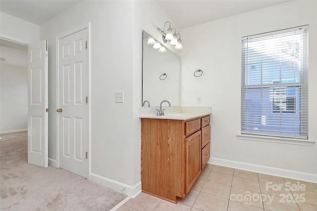 bathroom with tile patterned floors and vanity