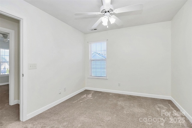 carpeted empty room with ceiling fan