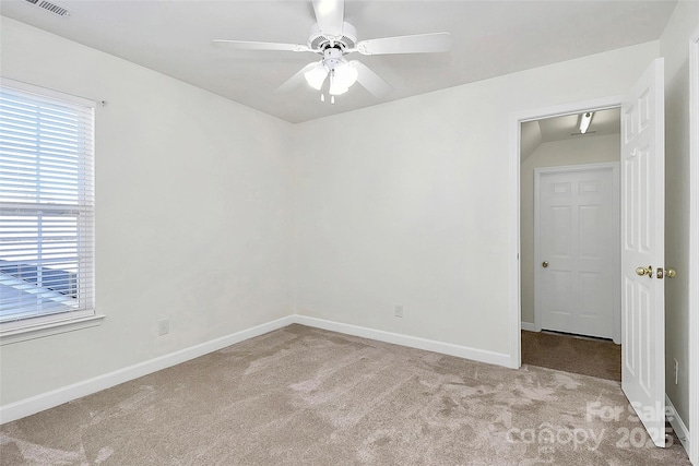 carpeted empty room featuring ceiling fan