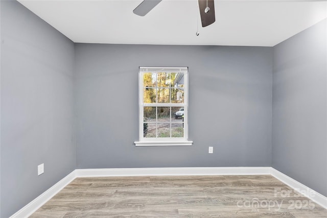 unfurnished room with ceiling fan and light hardwood / wood-style flooring