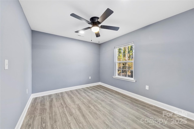 unfurnished room with light wood-type flooring and ceiling fan