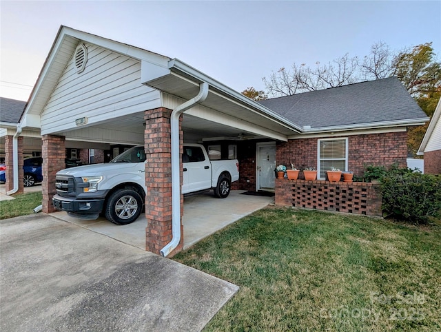 view of home's exterior featuring a yard and a carport