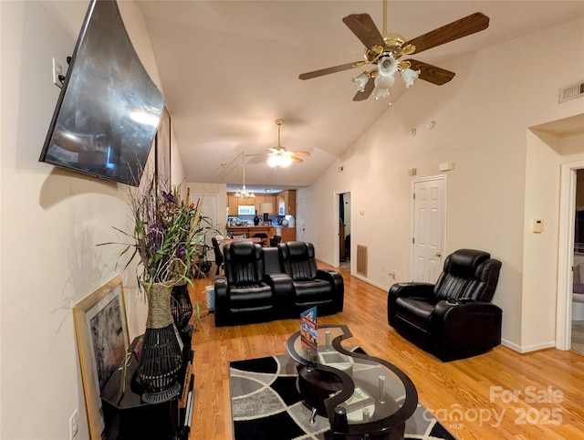 living room with lofted ceiling and hardwood / wood-style floors